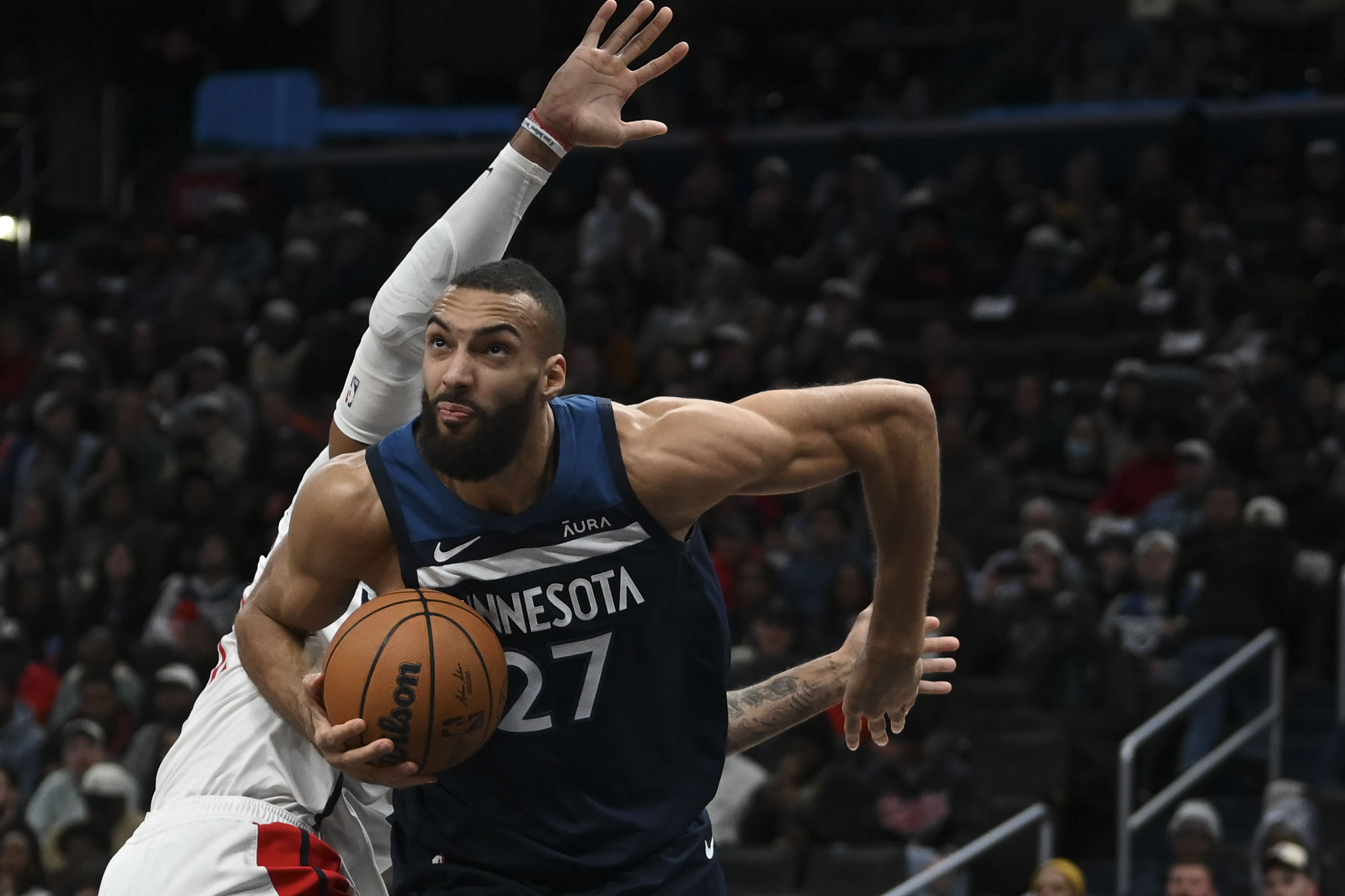Jan 24, 2024; Washington, District of Columbia, USA; Minnesota Timberwolves center Rudy Gobert (27) moves past Washington Wizards center Daniel Gafford (21) during the first half at Capital One Arena.