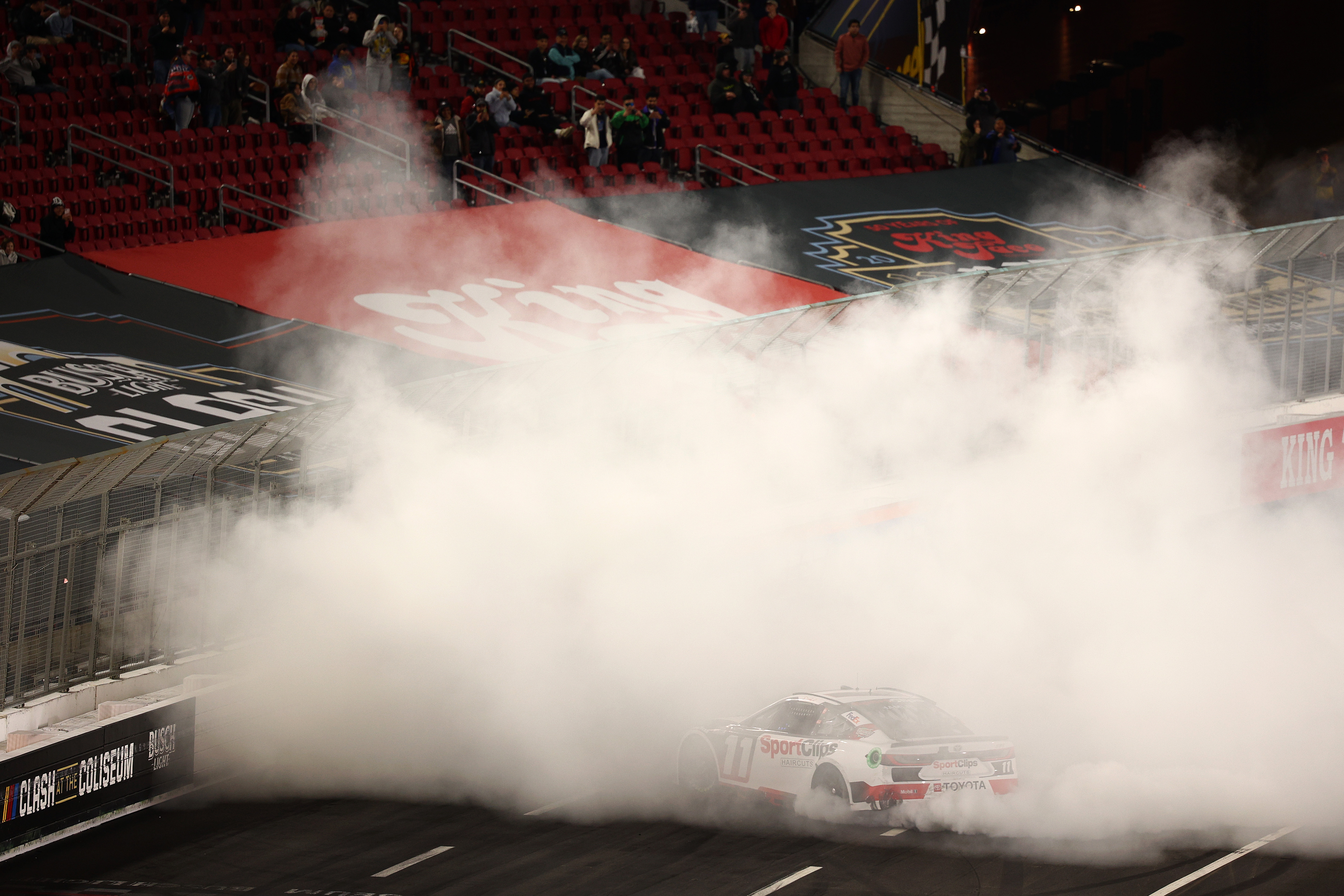 Denny Hamlin celebrates with a burnout after winning the NASCAR Cup Series Busch Light Clash at Los Angeles Memorial Coliseum on Saturday night. (Photo by Jared C. Tilton/Getty Images)
