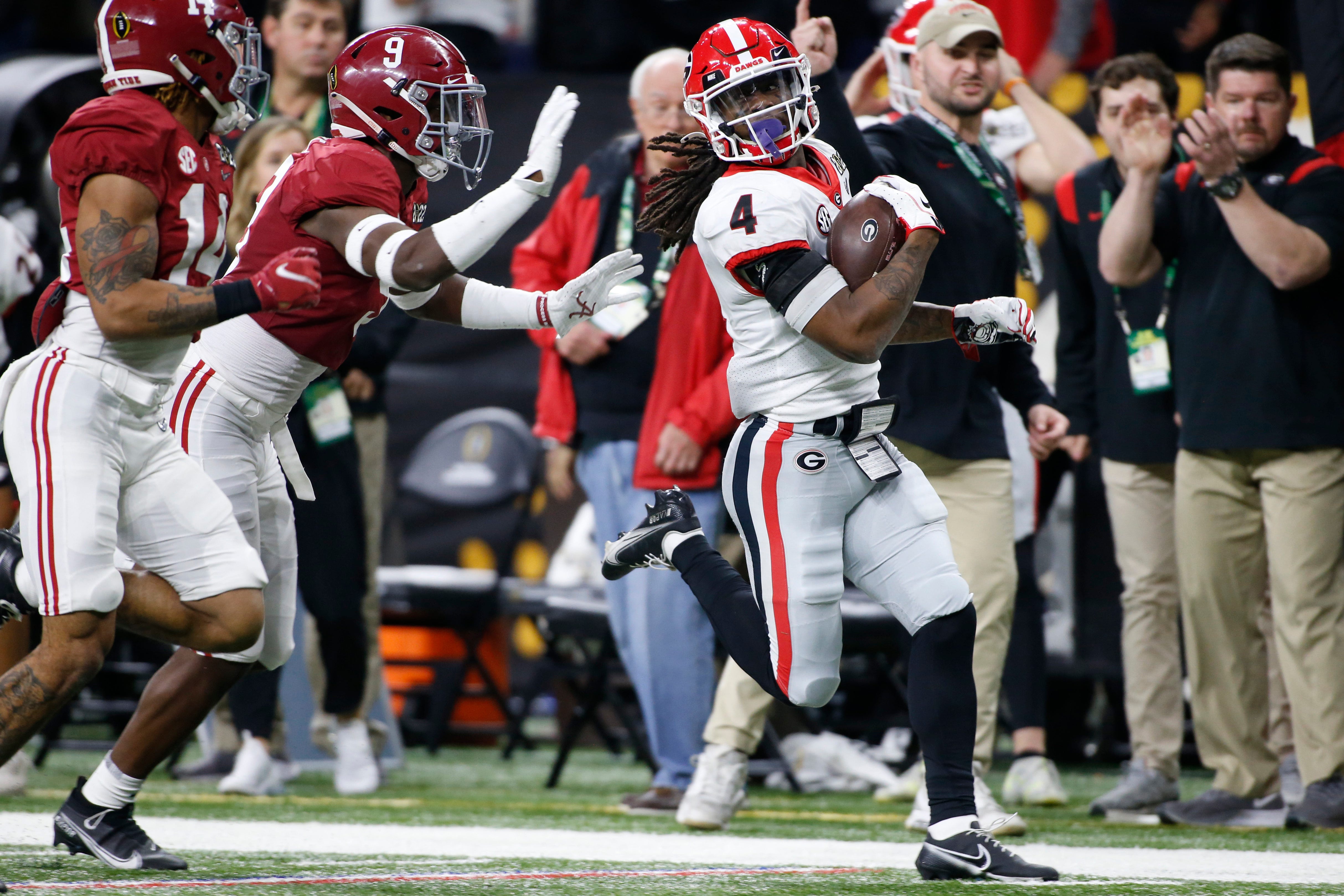 Georgia Bulldogs running back James Cook (4) breaks away for a 67 yard rush during the College Football Playoff National Championship against Alabama at Lucas Oil Stadium on Monday, Jan. 10, 2022, in Indianapolis. Georgia won 33-18. News Joshua L Jones