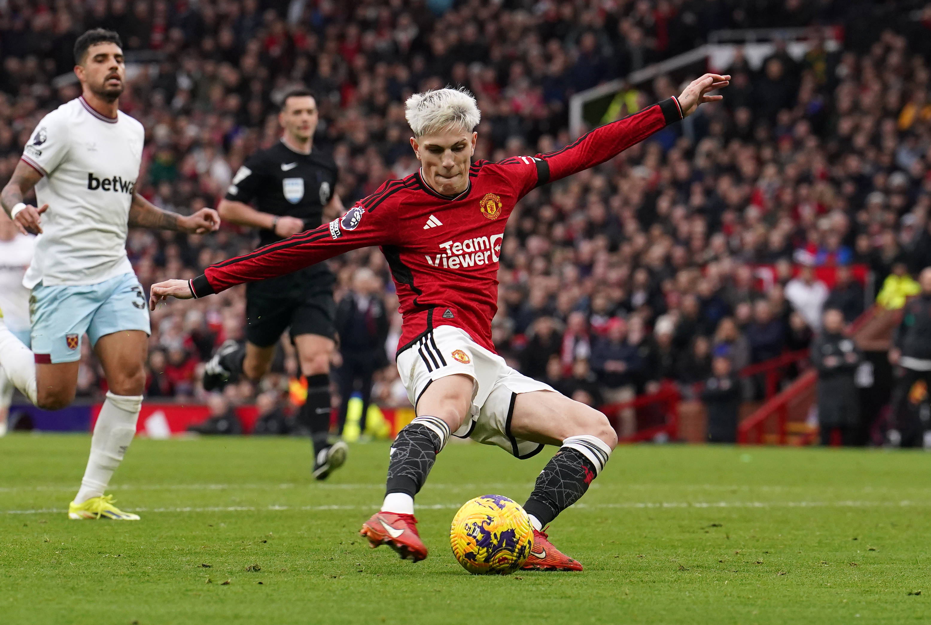Alejandro Garnacho pictured shooting to score his second goal of the game in Manchester United's 3-0 win over West Ham in February 2024