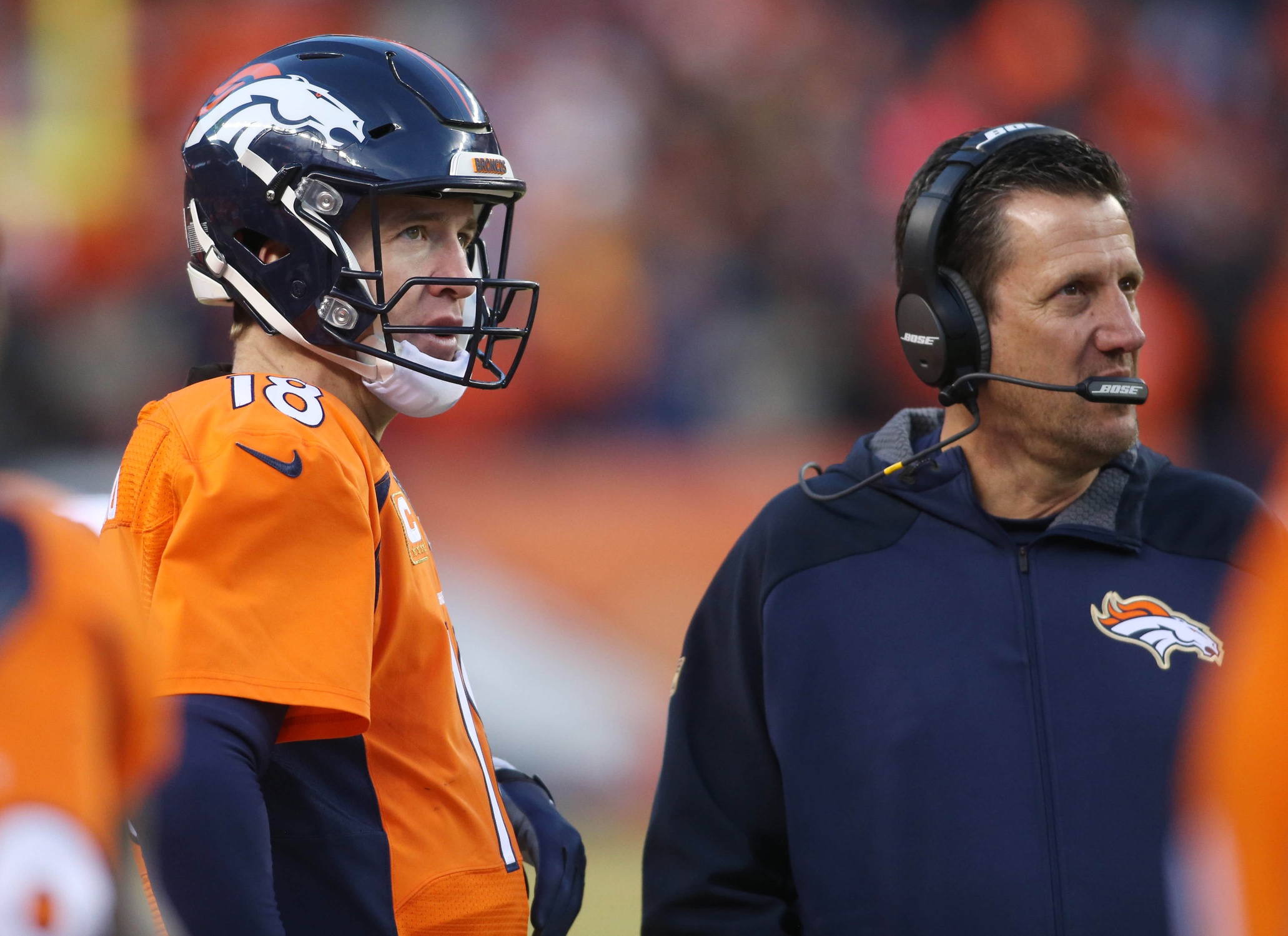 Jan 3, 2016; Denver Broncos quarterback Peyton Manning (18) and offensive coordinator Rick Dennison (right) against the San Diego Chargers. Mandatory Credit: Chris Humphreys-USA TODAY Sports
