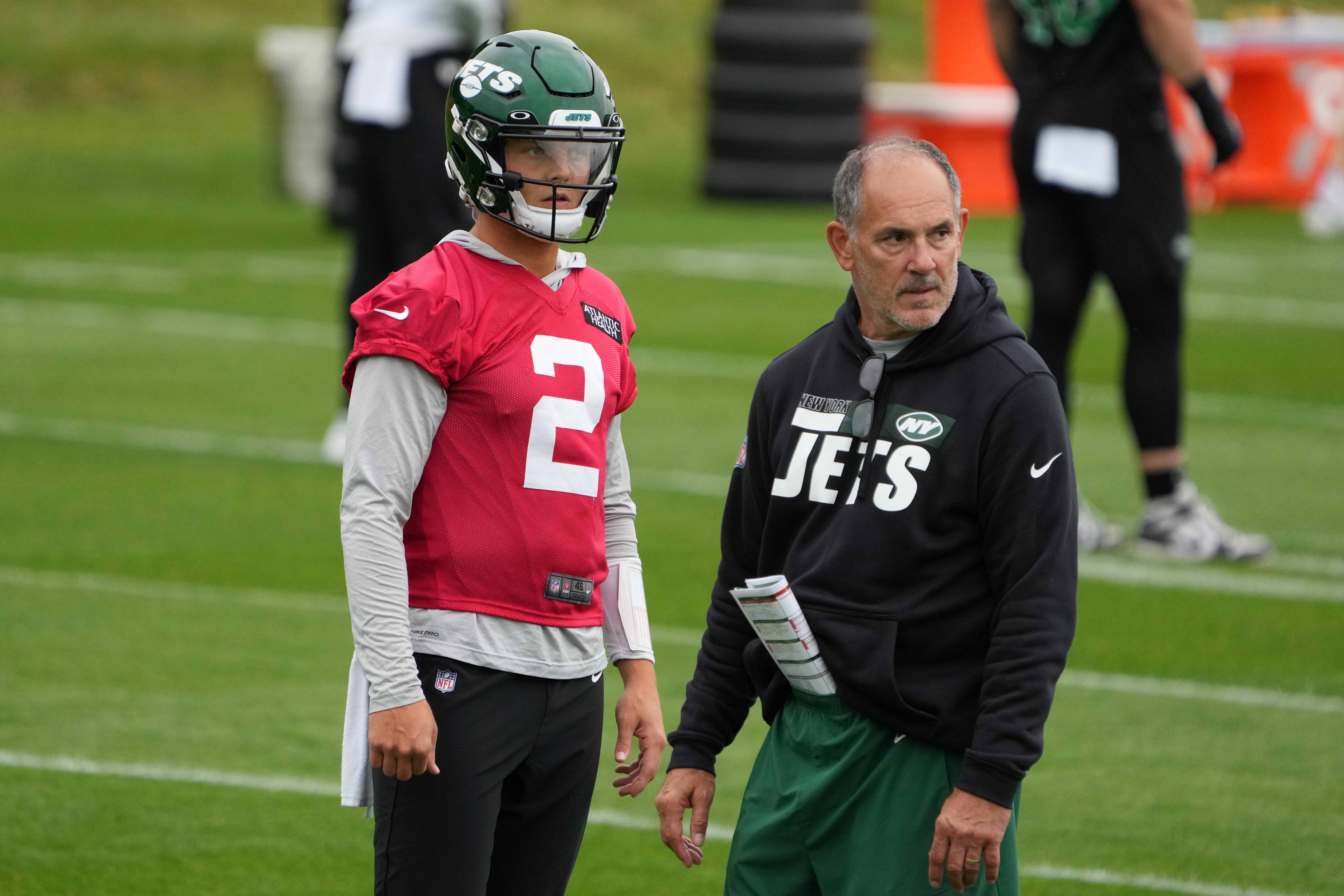 New York Jets quarterback Zach Wilson (2) and offensive line coach John Benton during a practice.