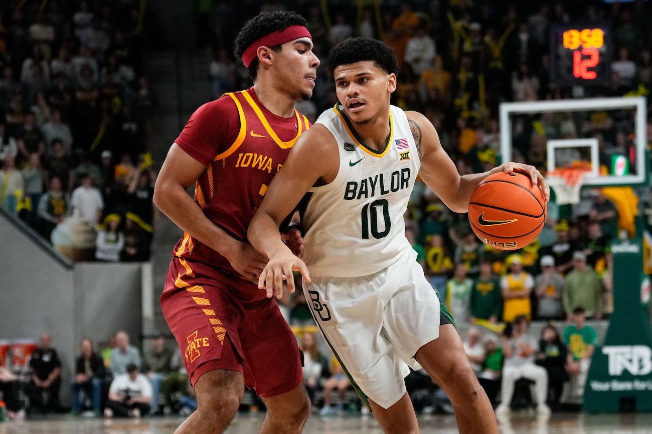 Baylor Bears guard RayJ Dennis (10) drives to the basket against Iowa State Cyclones guard Curtis Jones (5) during the second half at Paul and Alejandra Foster Pavilion in Waco, Texas, on Feb 3, 2024.