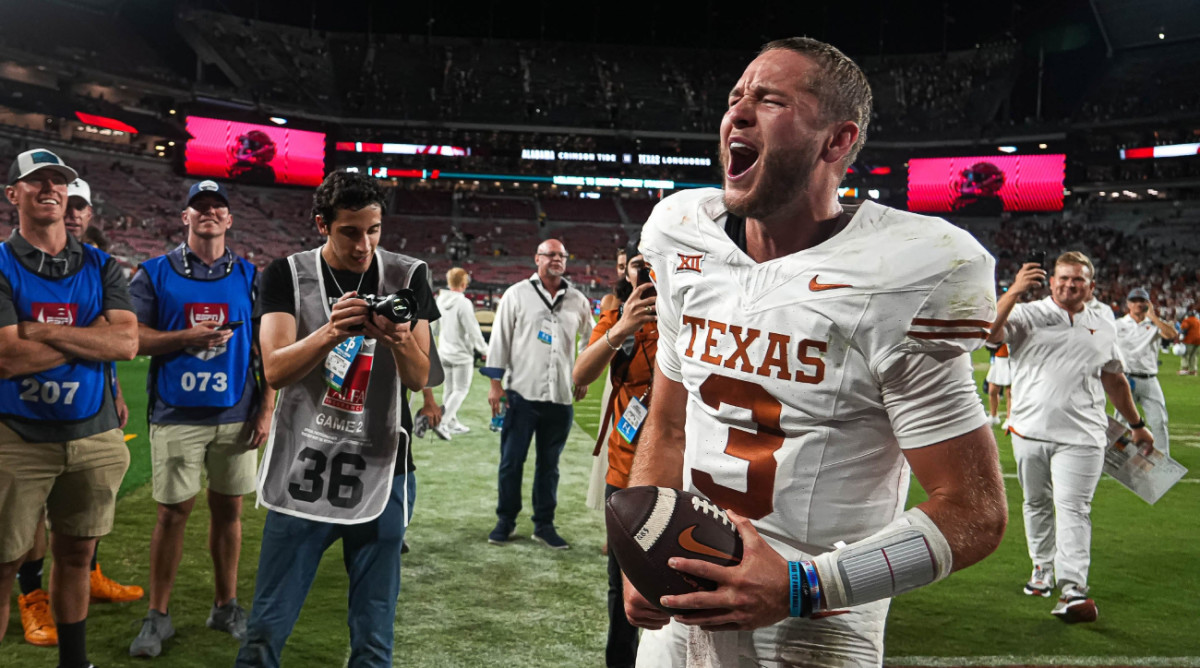 Texas quarterback Quinn Ewers yells while leaving the field after beating Alabama.