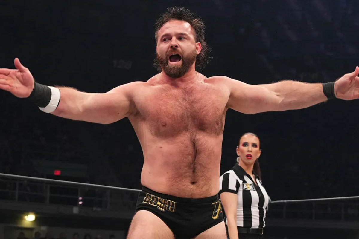 Cash Wheeler, one half of FTR, poses in the middle of an AEW match.