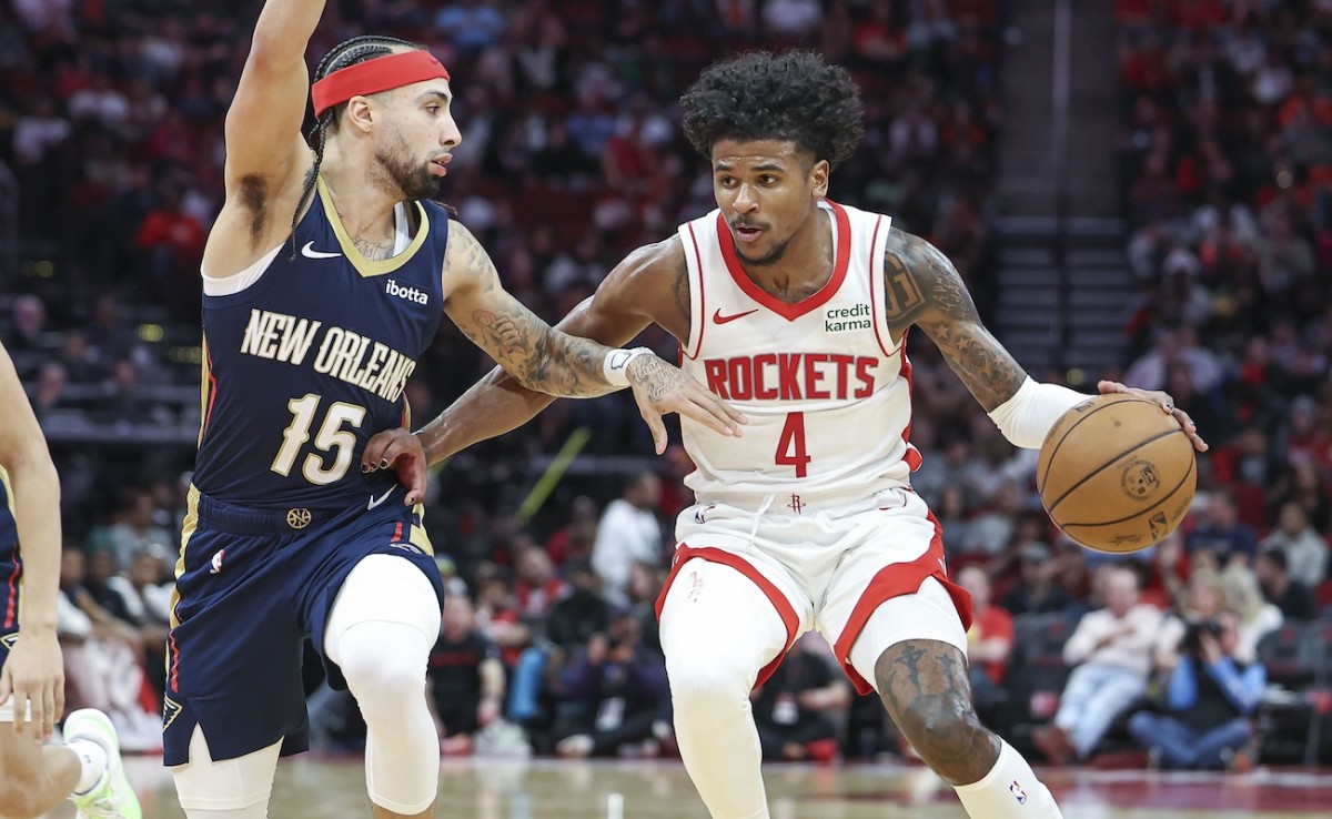 Houston Rockets guard Jalen Green controls the ball as New Orleans Pelicans guard Jose Alvarado defends during the third quarter at Toyota Center in Houston on Jan. 31, 2024.