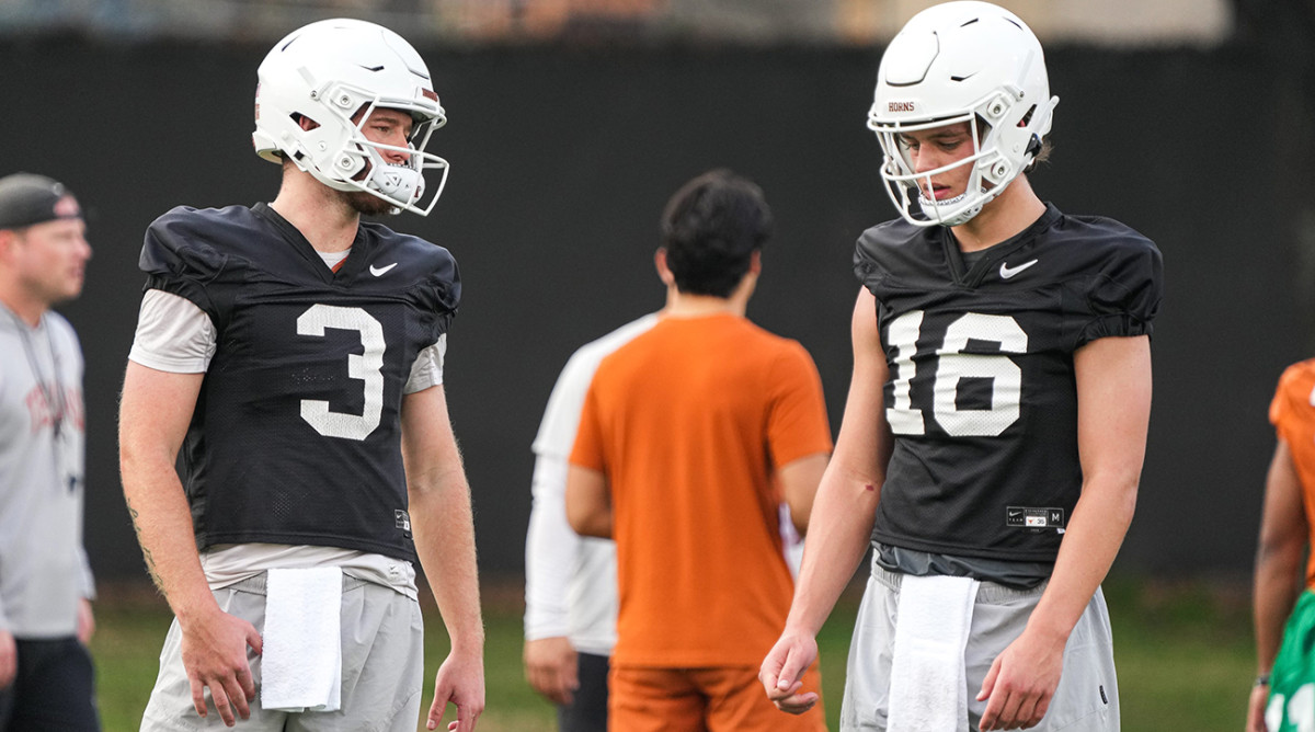 Quarterbacks Quinn Ewers (3) and Arch Manning (16) talk during the first Texas football practice of 2023 at the Frank Denius Fields.