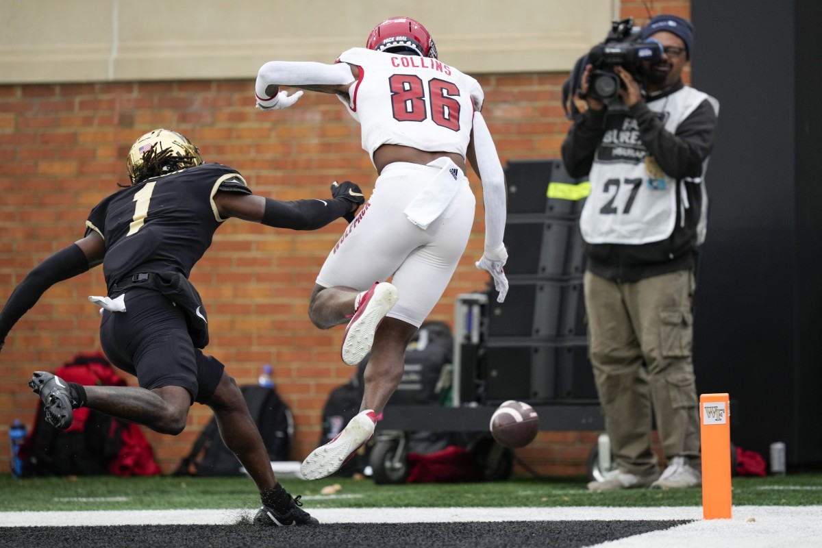 Nov 11, 2023; Winston-Salem, North Carolina, USA; North Carolina State Wolfpack wide receiver Dacari Collins (86) misses a pass broken up by Wake Forest Demon Deacons defensive back Caelen Carson (1) during the second half at Allegacy Federal Credit Union Stadium. Mandatory Credit: Jim Dedmon-USA TODAY Sports  