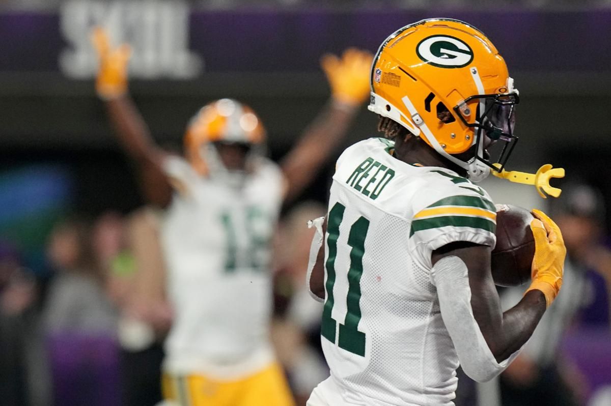 Green Bay Packers wide receiver Jayden Reed (11) catches a touchdown pass during the first quarter of their game Sunday, December 31, 2023 at U.S. Bank Stadium in Minneapolis, Minnesota. The Green Bay Packers beat the Minnesota Vikings 33-10.