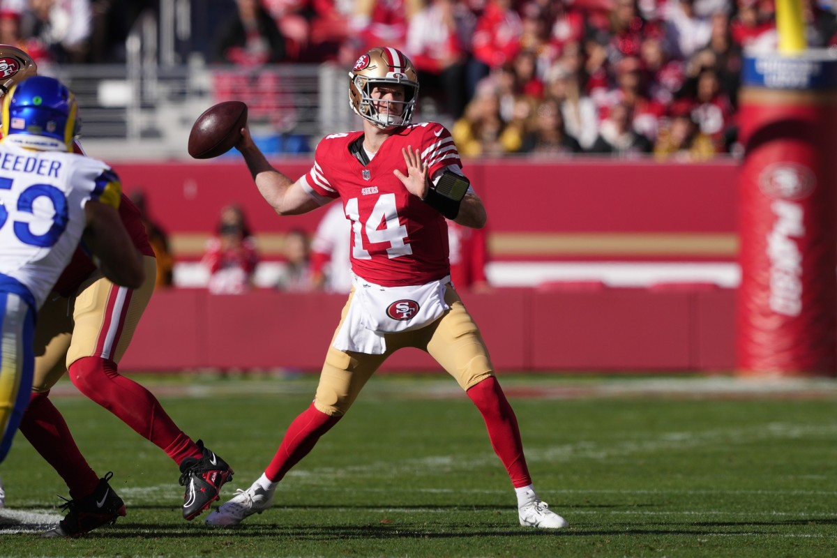 Jan 7, 2024; San Francisco 49ers quarterback Sam Darnold (14) throws a pass against the Los Angeles Rams. Mandatory Credit: Darren Yamashita-USA TODAY Sports