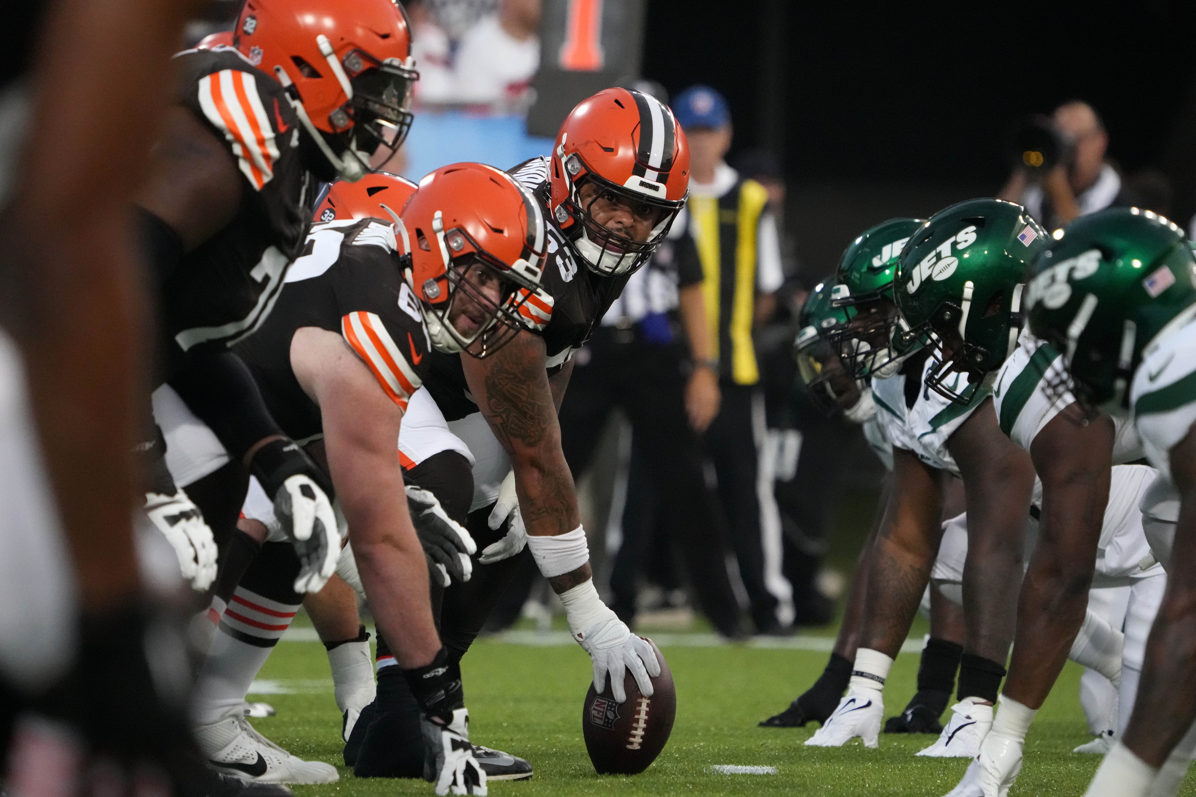 Aug 3, 2023; Canton, Ohio, USA; A general overall view of helmets at the line of scrimmage as Cleveland Browns center Nick Harris (53) snaps the ball against the New York Jets during the first half at Tom Benson Hall of Fame Stadium. Mandatory Credit: Kirby Lee-USA TODAY Sports