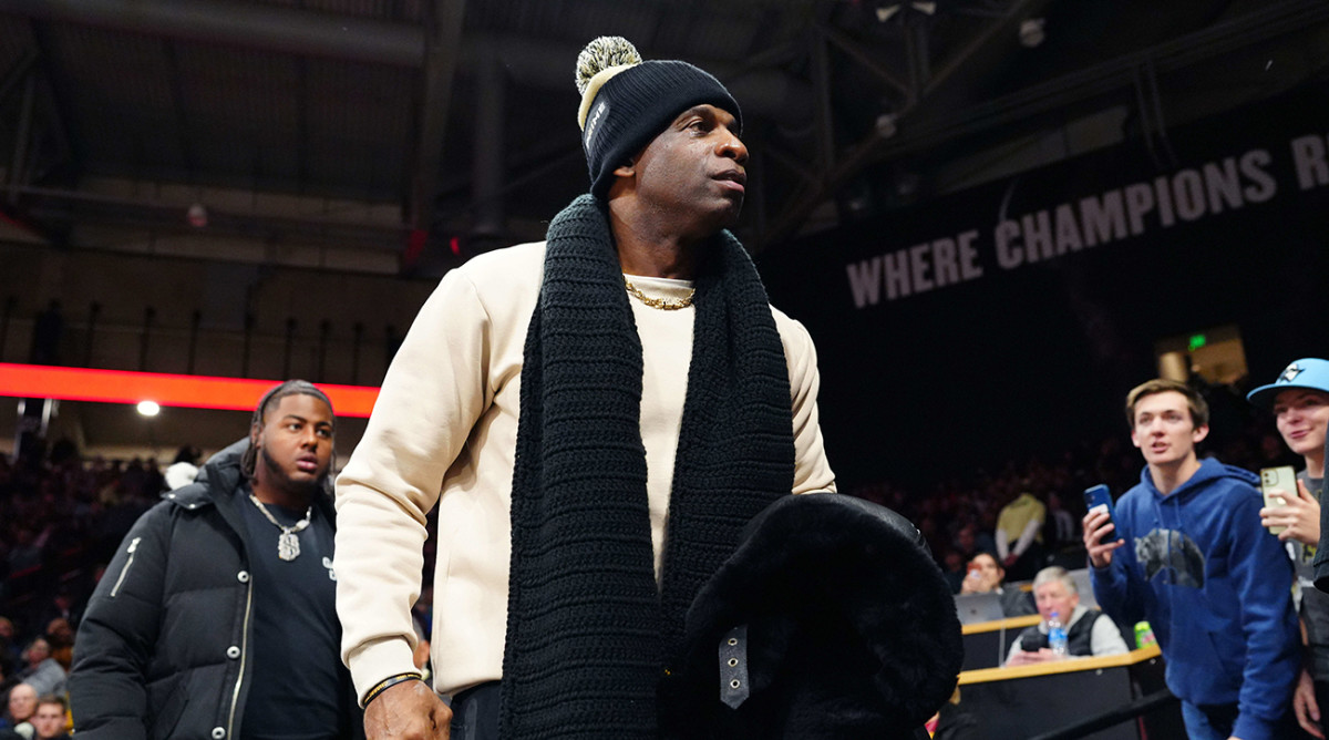 Colorado football coach Deion Sanders leaves the stands during the second half of the game against USC basketball at the CU Events Center.