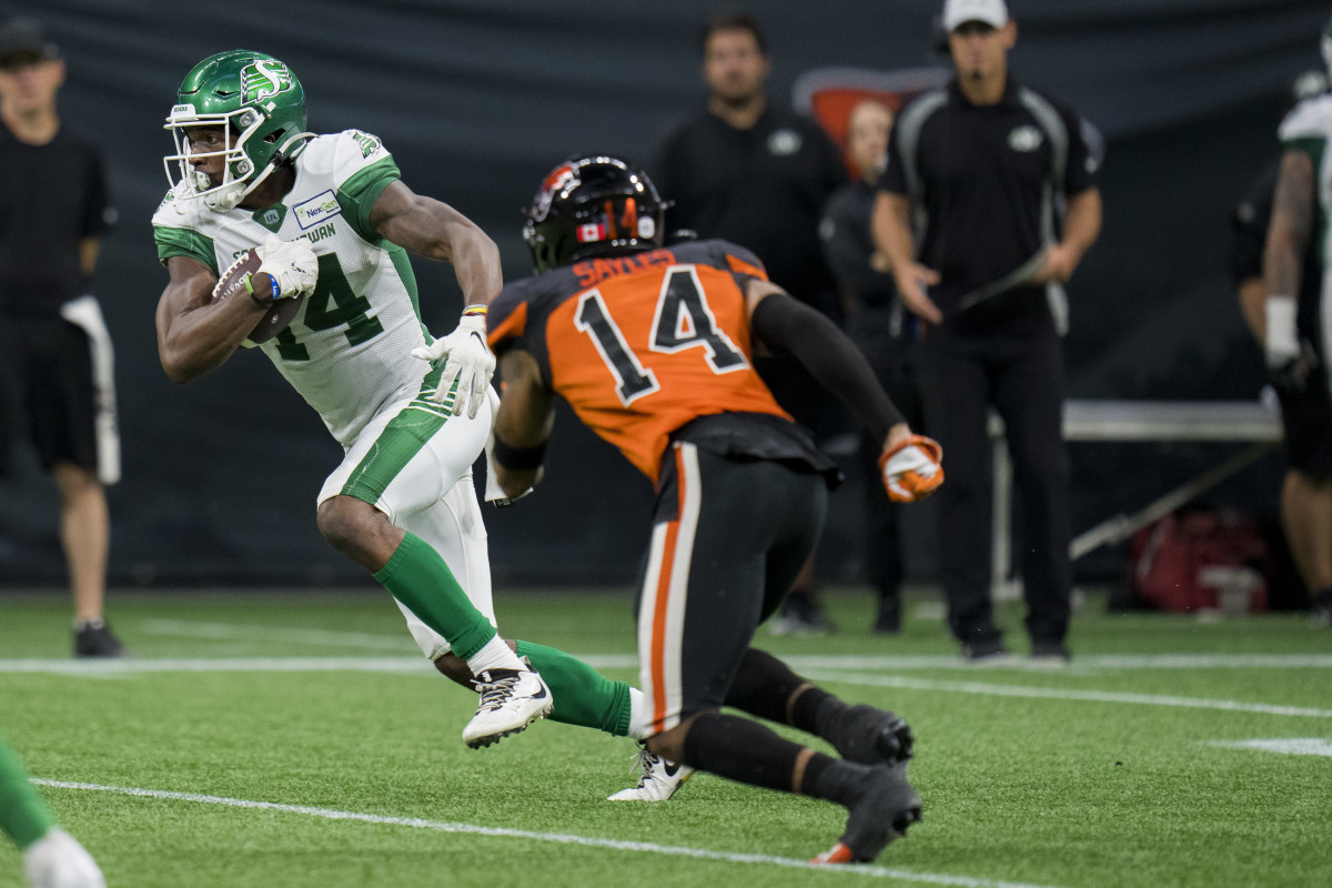 Aug 26, 2022; Vancouver, British Columbia, CAN; Saskatchewan Roughriders wide receiver Tevin Jones (14) runs with the ball against the BC Lions in the second half at BC Place. Mandatory Credit: Bob Frid-USA TODAY Sports