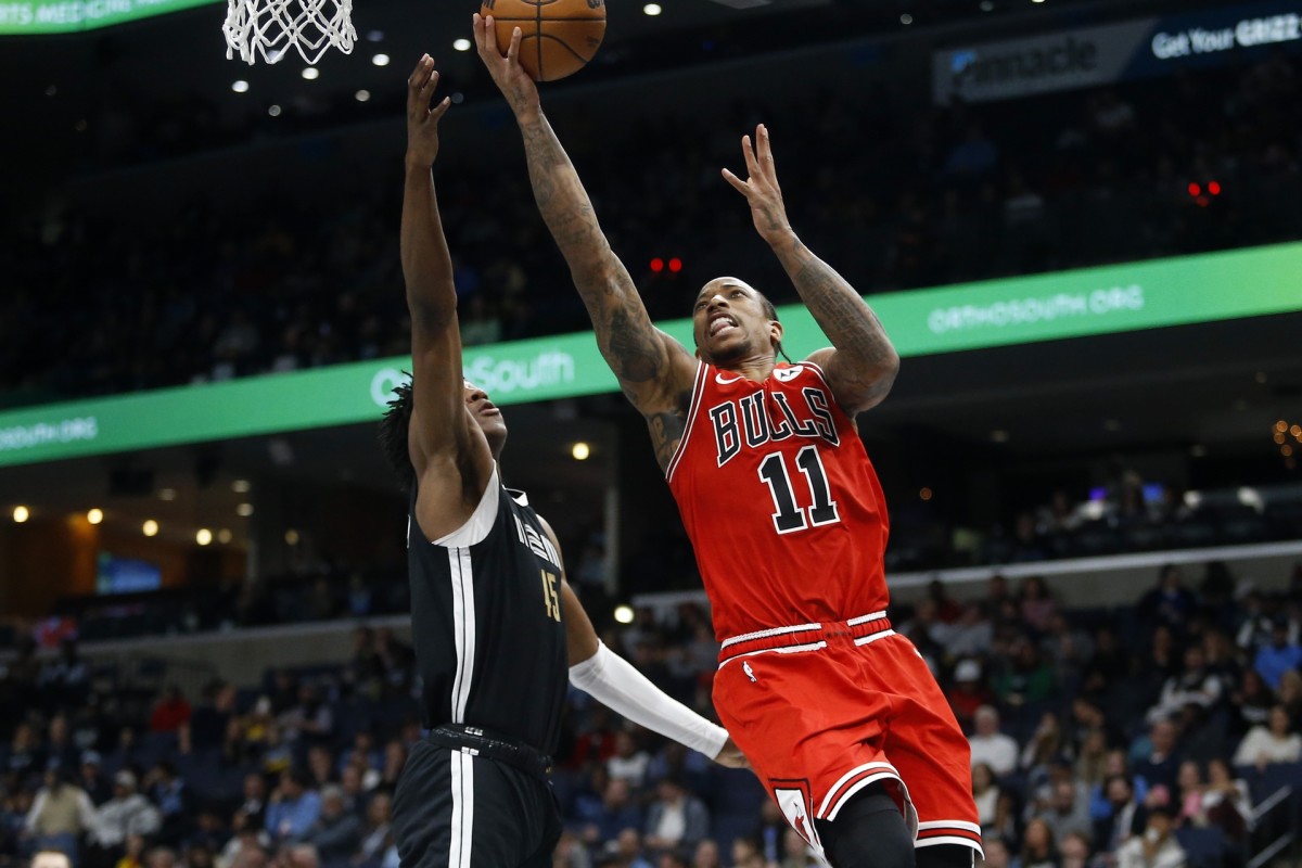 Chicago Bulls forward DeMar DeRozan (11) drives to the basket as Memphis Grizzlies forward GG Jackson (45) defends during the second half at FedExForum.