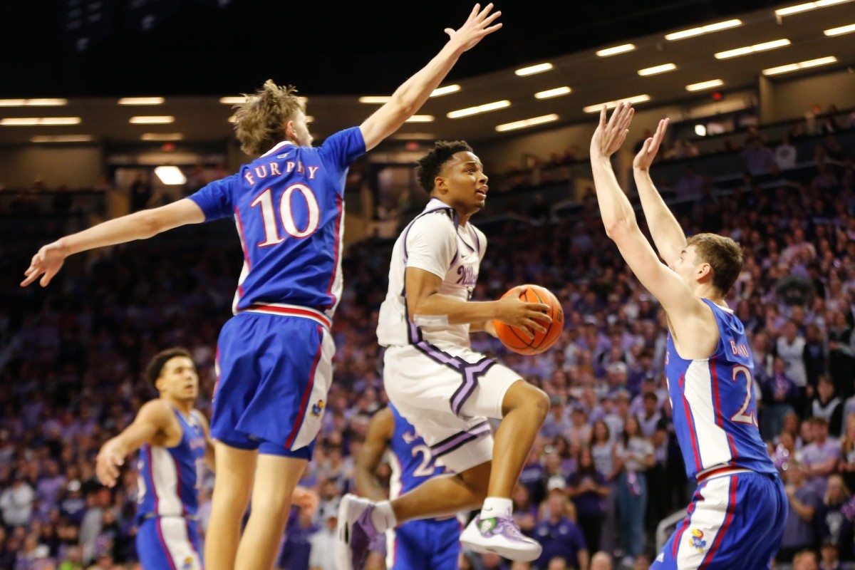Kansas State guard Tylor Perry (2) jumps for a layup against Kansas in the first half of the Sunflower Showdown inside Bramlage Coliseum on Feb. 5, 2024.