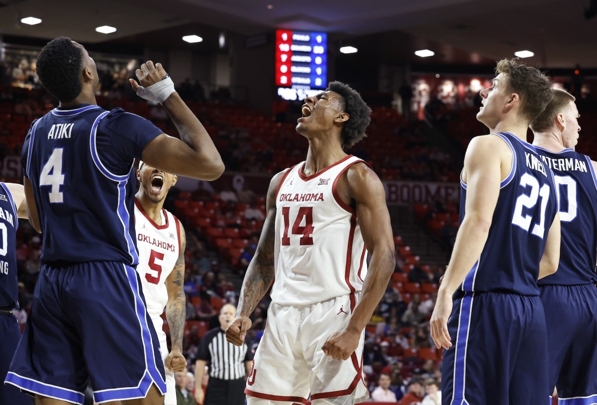 Oklahoma Sooners forward Jalon Moore (14) celebrates a basket against Brigham Young Cougars during the second half at Lloyd Noble Center in Norman, Oklahoma, on Feb. 6, 2024.