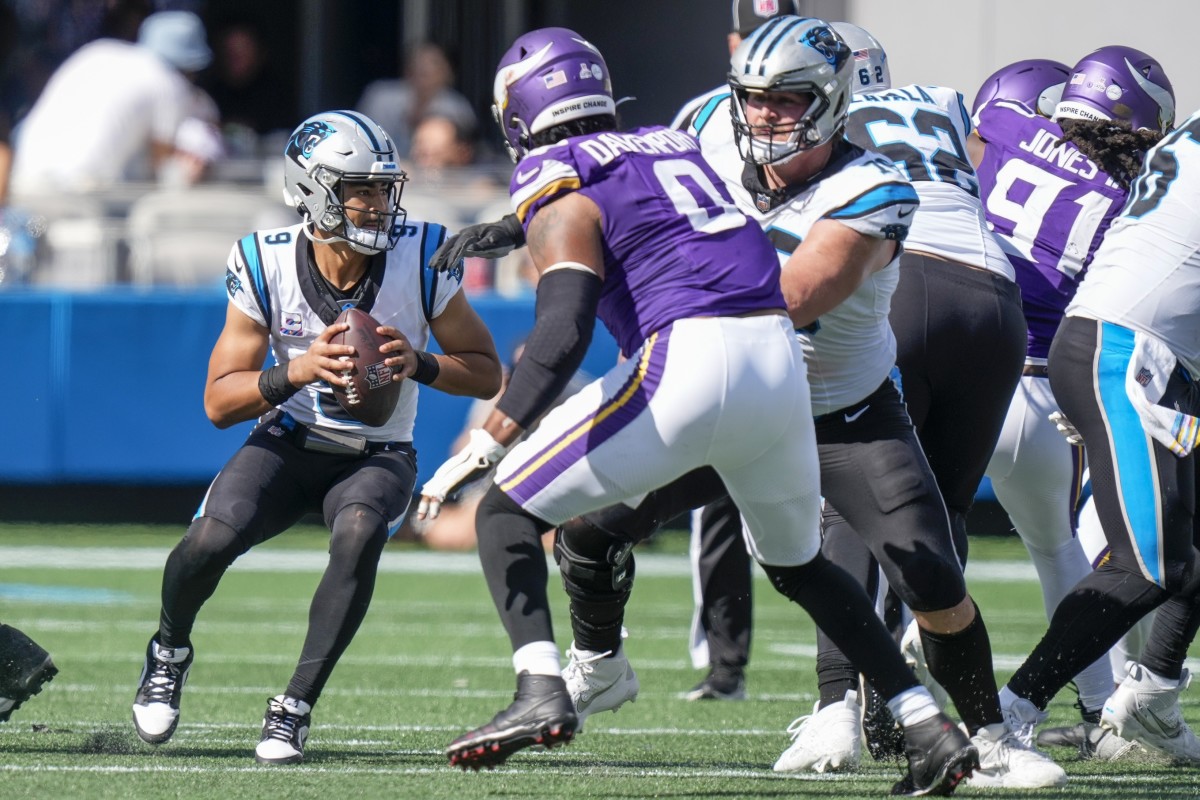 Oct 1, 2023; Charlotte, North Carolina, USA; Carolina Panthers quarterback Bryce Young (9) is hurried by Minnesota Vikings linebacker Marcus Davenport (0) during the second half at Bank of America Stadium.