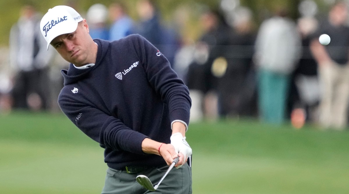 Justin Thomas pitches onto the 15th green during round two of the WM Phoenix Open at TPC Scottsdale.