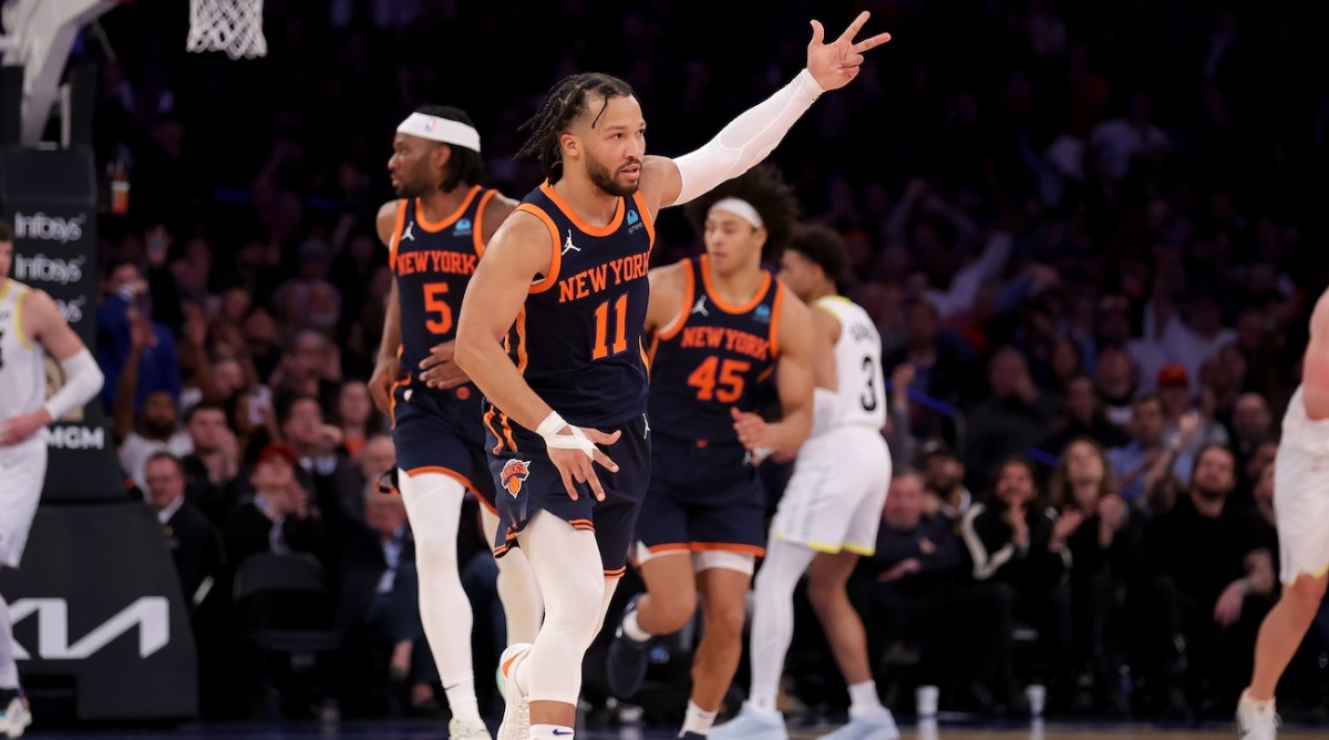 New York Knicks guard Jalen Brunson (11) celebrates his three point shot against the Utah Jazz during the third quarter at Madison Square Garden in New York City on Jan. 30, 2024.