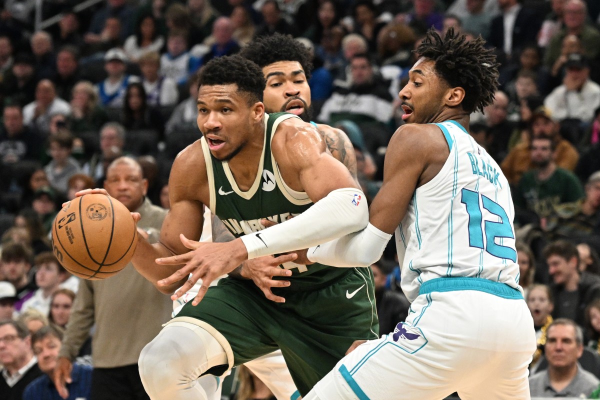 Milwaukee Bucks forward Giannis Antetokounmpo (34) attempts to drive against Charlotte Hornets forward Leaky Black (12) in the second half at Fiserv Forum.