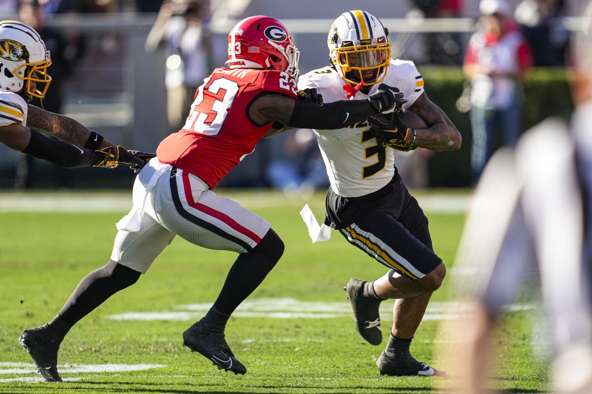 Nov 4, 2023; Athens, Georgia, USA; Missouri Tigers wide receiver Luther Burden III (3) runs against Georgia Bulldogs defensive back Tykee Smith (23) during the first half at Sanford Stadium. Mandatory Credit: Dale Zanine-USA TODAY Sports  