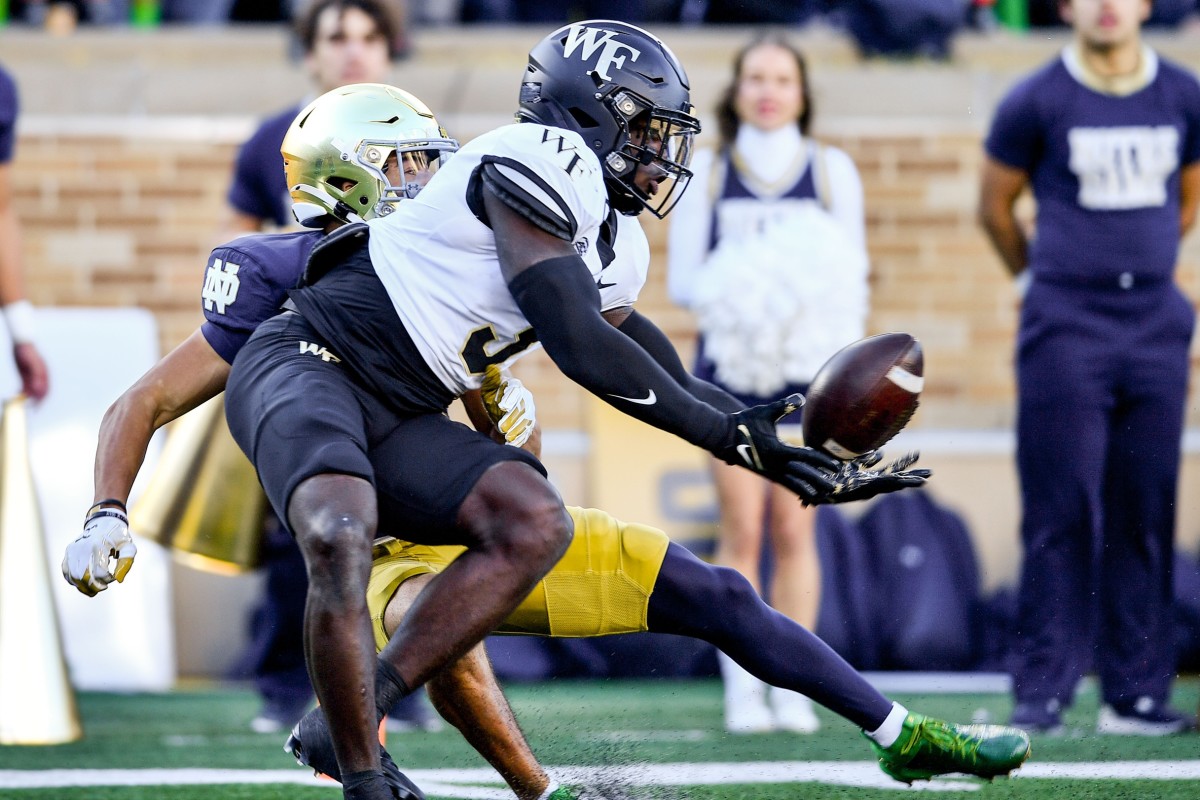 Nov 18, 2023; South Bend, Indiana, USA; Wake Forest Demon Deacons safety Malik Mustapha (3) breaks up a pass intended for Notre Dame Fighting Irish wide receiver Jordan Faison (80) in the first quarter at Notre Dame Stadium. Mandatory Credit: Matt Cashore-USA TODAY Sports  