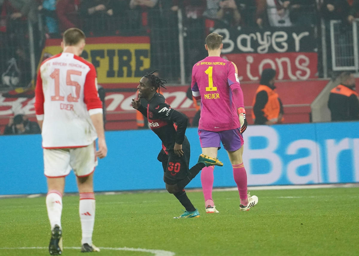 Jeremie Frimpong pictured (center) running past Manuel Neuer (right) after scoring a sensational last-minute goal to seal a 3-0 win for Bayer Leverkusen against Bayern Munich in the Bundesliga in February 2024