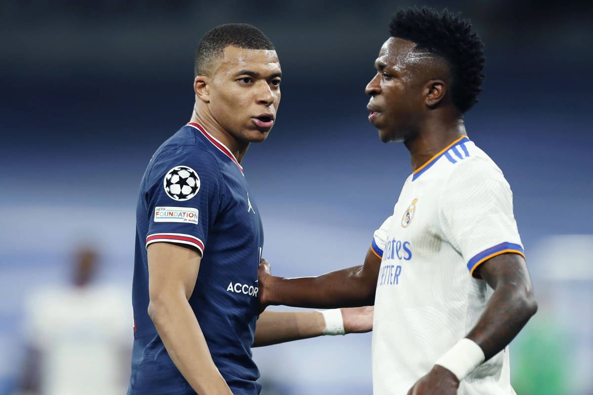 Vinicius Junior (right) and Kylian Mbappe pictured during a UEFA Champions League game between Real Madrid and Paris Saint-Germain in March 2022