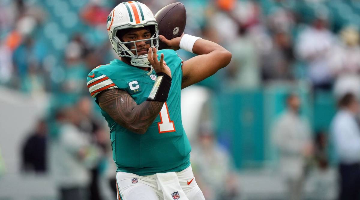 Miami Dolphins quarterback Tua Tagovailoa throws a pass in warmups before a game.