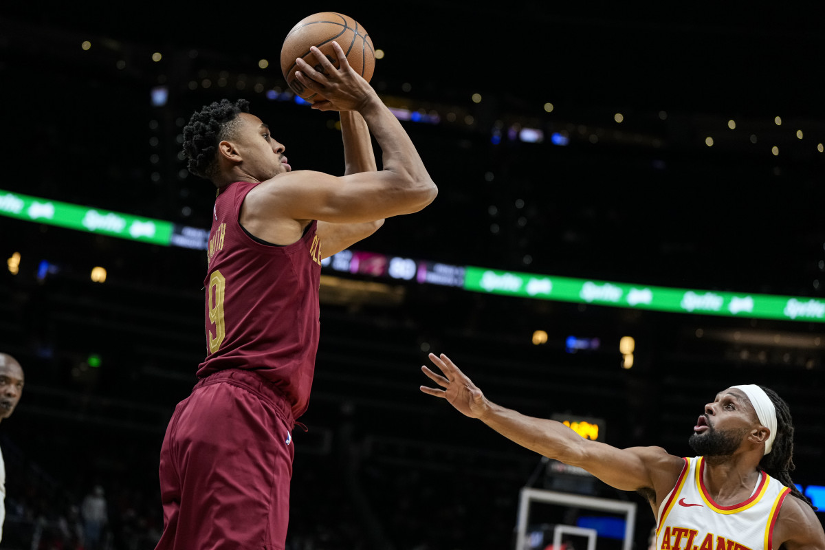 Oct 10, 2023; Atlanta, Georgia, USA; Cleveland Cavaliers guard Zhaire Smith (19) shoots over Atlanta Hawks guard Patty Mills (8) during the second half at State Farm Arena.