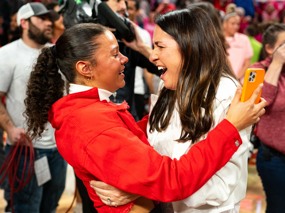 Feb 11, 2024; Lincoln, Nebraska, USA; Nebraska Cornhuskers head coach Amy Williams celebrates with her daughter Kennadi after defeating the Iowa Hawkeyes at Pinnacle Bank Arena.