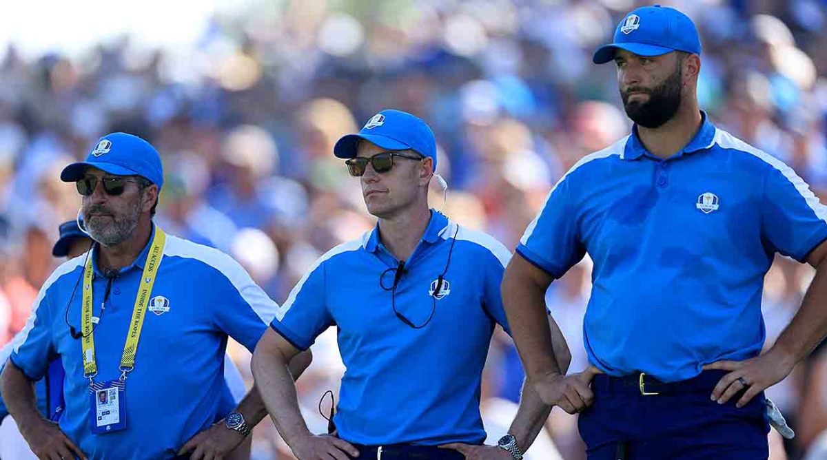 European Team captain Luke Donald of England is flanked by his vice-captain Jose Maria Olazabal (L) and Jon Rahm (R) beside the 15th green during the Friday morning foursomes matches of the 2023 Ryder Cup at Marco Simone Golf Club in Rome, Italy.