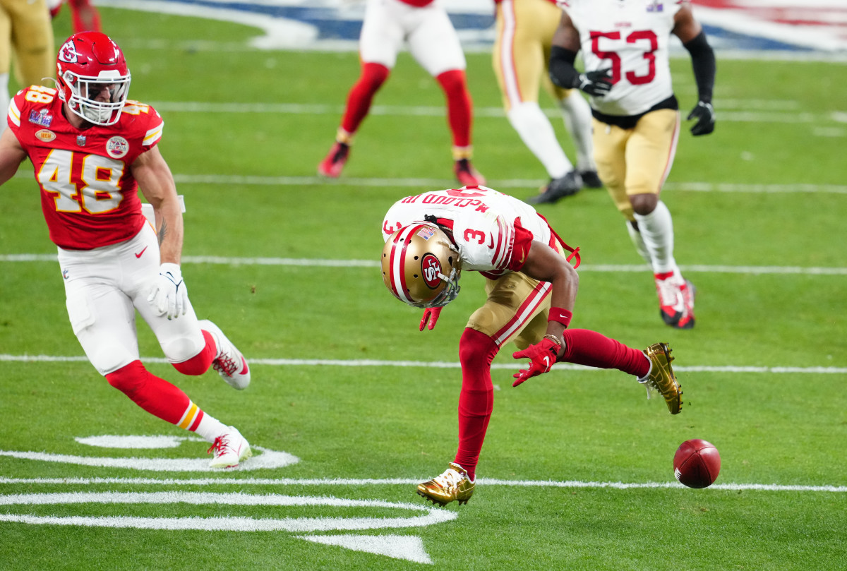 Ray Ray McCloud III leans over to try to grab the ball