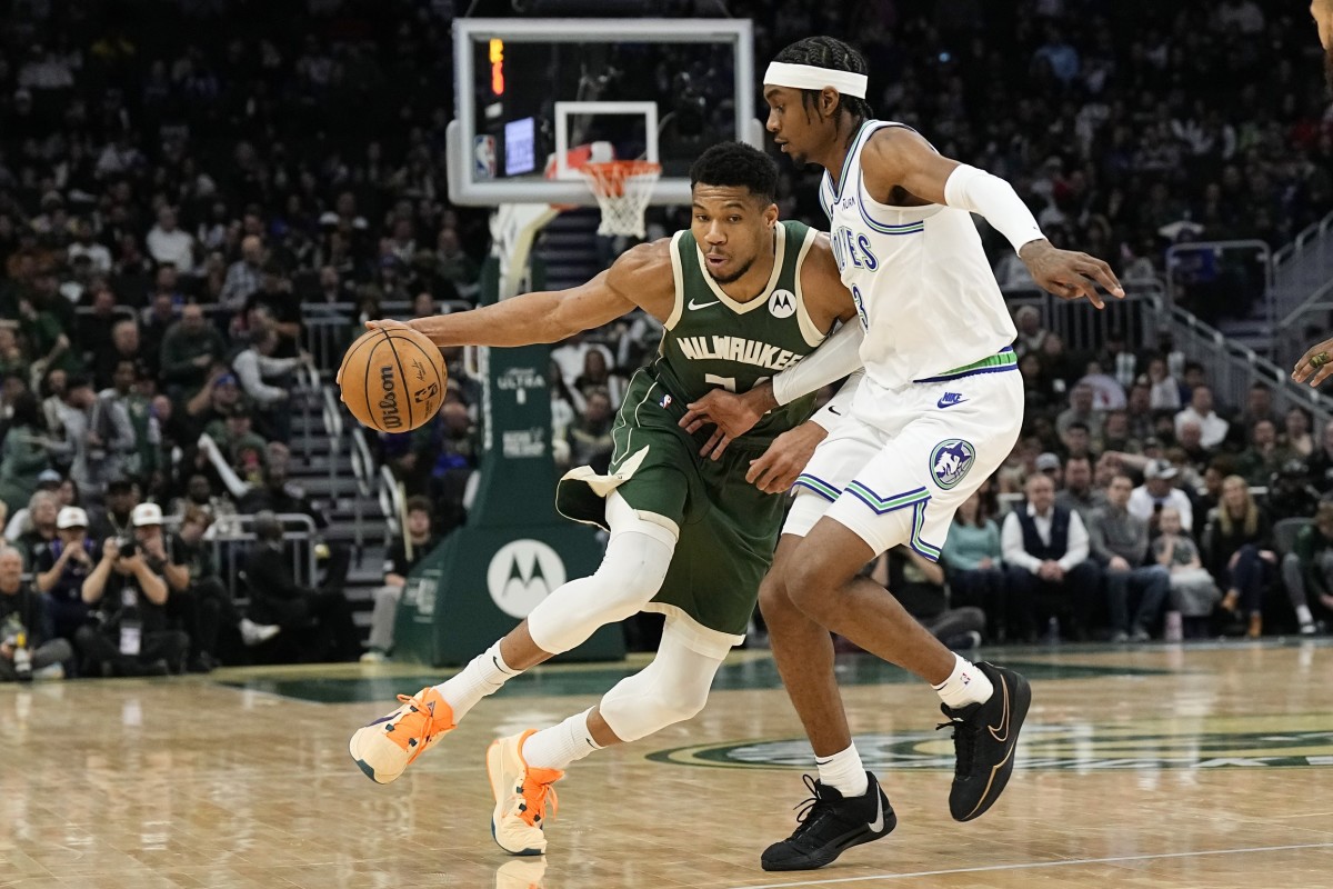 Feb 8, 2024; Milwaukee, Wisconsin, USA; Milwaukee Bucks forward Giannis Antetokounmpo (34) drives for the basket against Minnesota Timberwolves forward Jaden McDaniels (3) during the third quarter at Fiserv Forum.