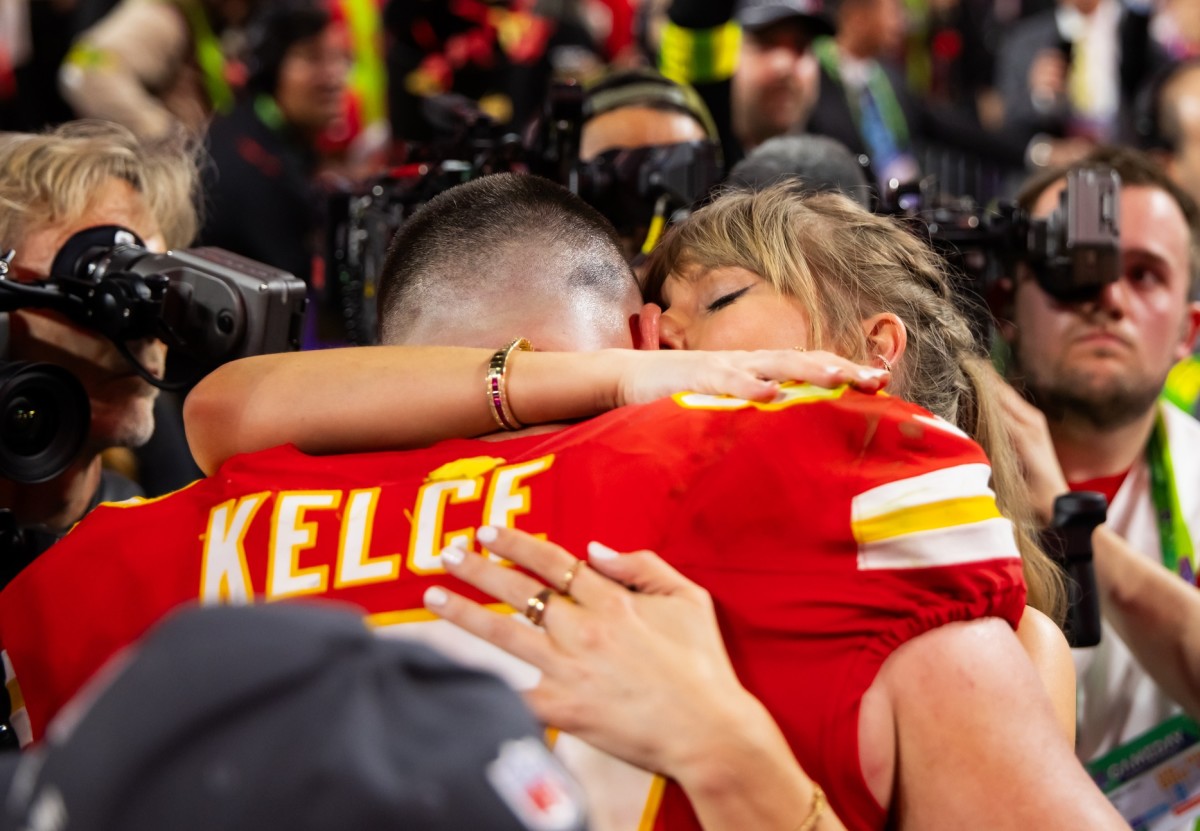 Kansas City Chiefs tight end Travis Kelce and Taylor Swift embrace after the Chiefs defeated the San Francisco 49ers in Super Bowl LVIII.