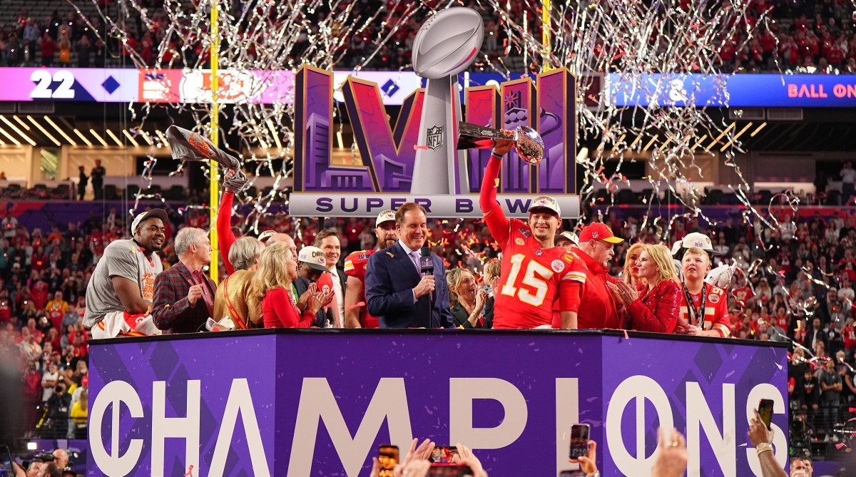 Patrick Mahomes lifting the Lombardi trophy.