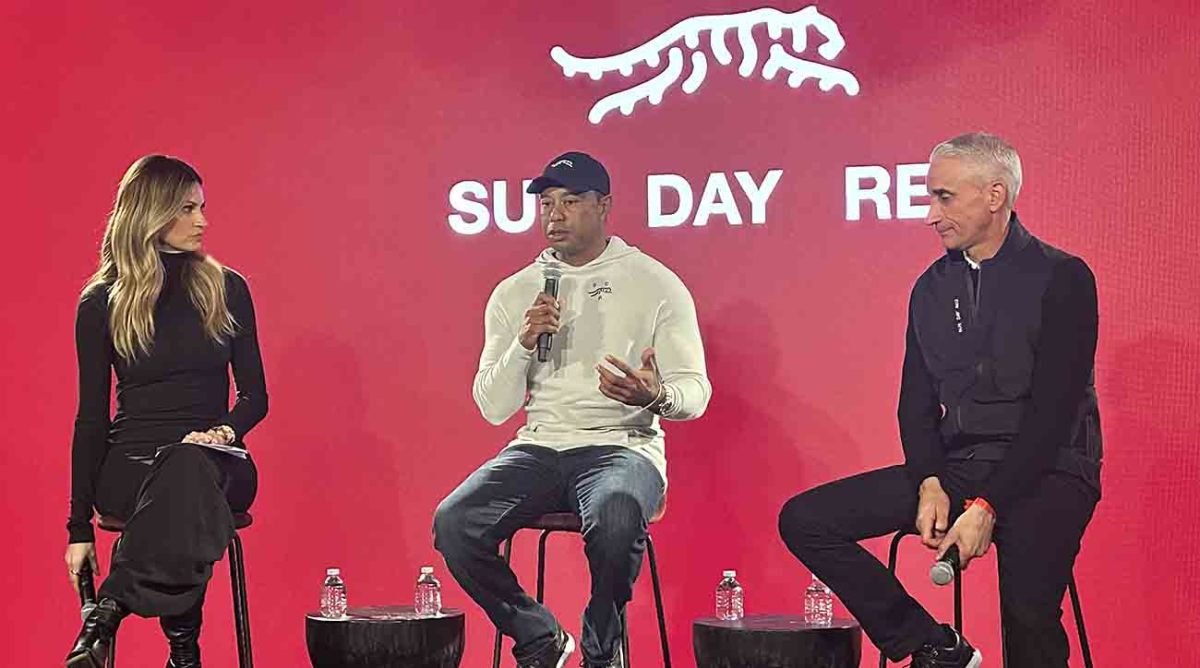 Tiger Woods announces his new Sun Day Red brand on Monday, Feb. 12, with host Erin Andrews and TaylorMade CEO David Abeles.