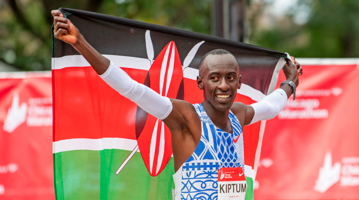 Kenyan Kelvin Kiptum celebrates winning the Chicago Marathon in Oct. 2023.