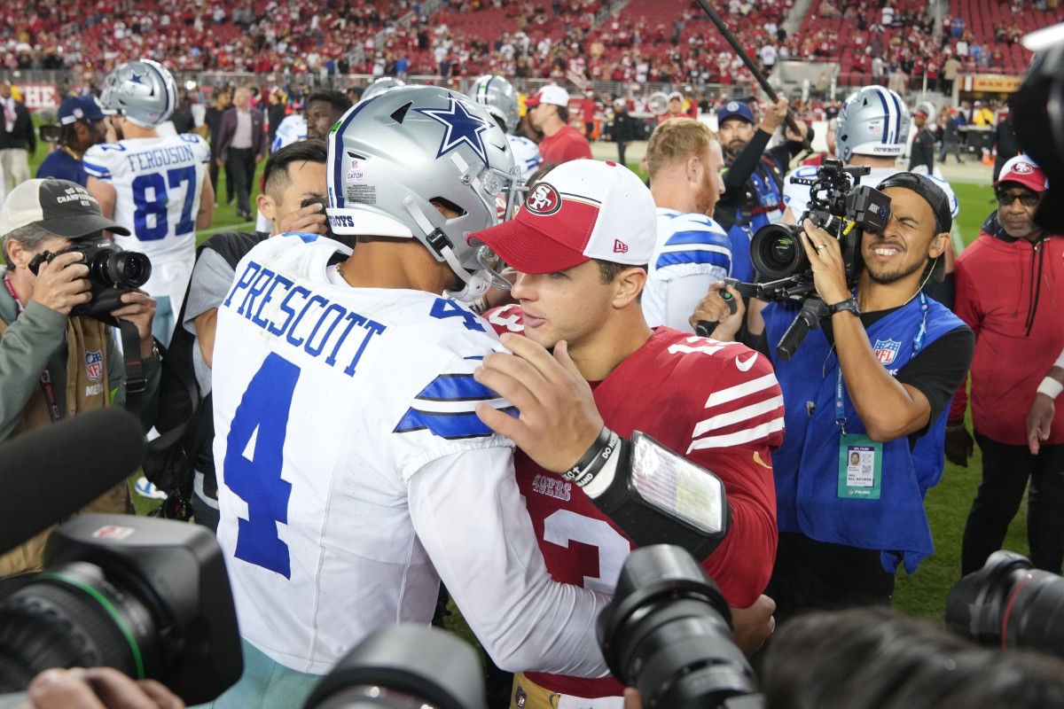 Oct 8, 2023; Santa Clara, California, USA; Dallas Cowboys quarterback Dak Prescott (4) and San Francisco 49ers quarterback Brock Purdy (center right) embrace after the game at Levi's Stadium.