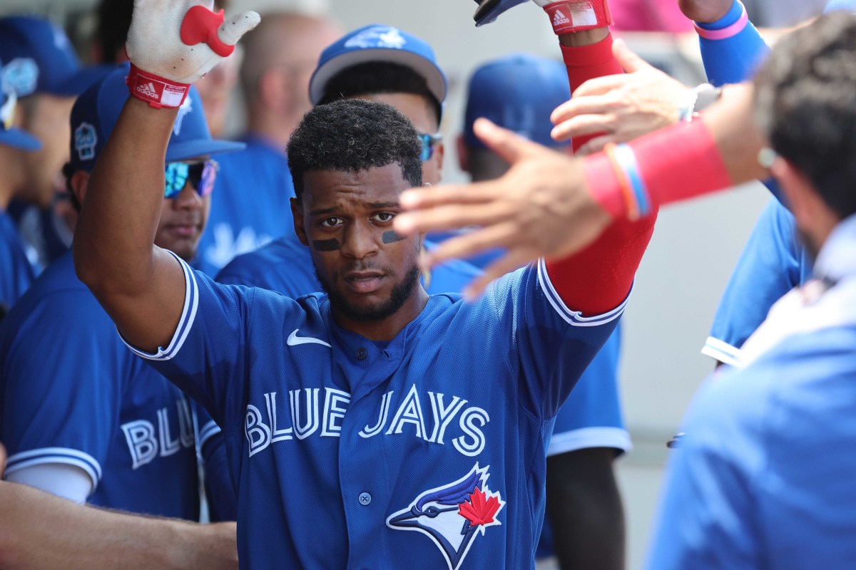 Toronto Blue Jays shortstop Otto Lopez scores a run against the Minnesota Twins during the third inning at Lee County Sports Complex. (2023)