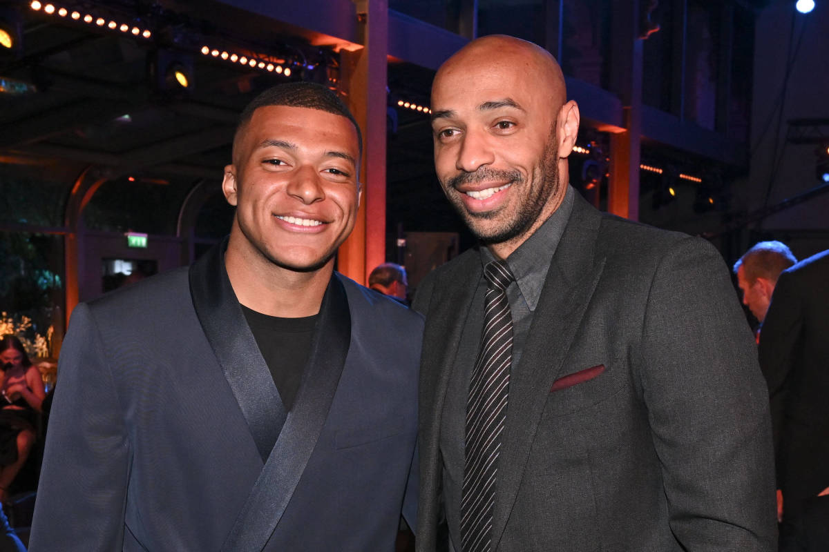Kylian Mbappe and Thierry Henry pictured posing for a photo together at an awards ceremony in May 2022