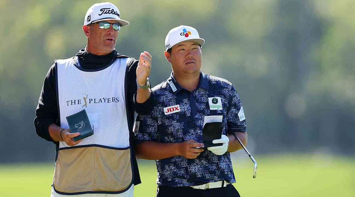 Sungjae Im talks with his caddie Lance Bennett during the 2023 Players Championship at TPC Sawgrass in Ponte Vedra Beach, Fla.