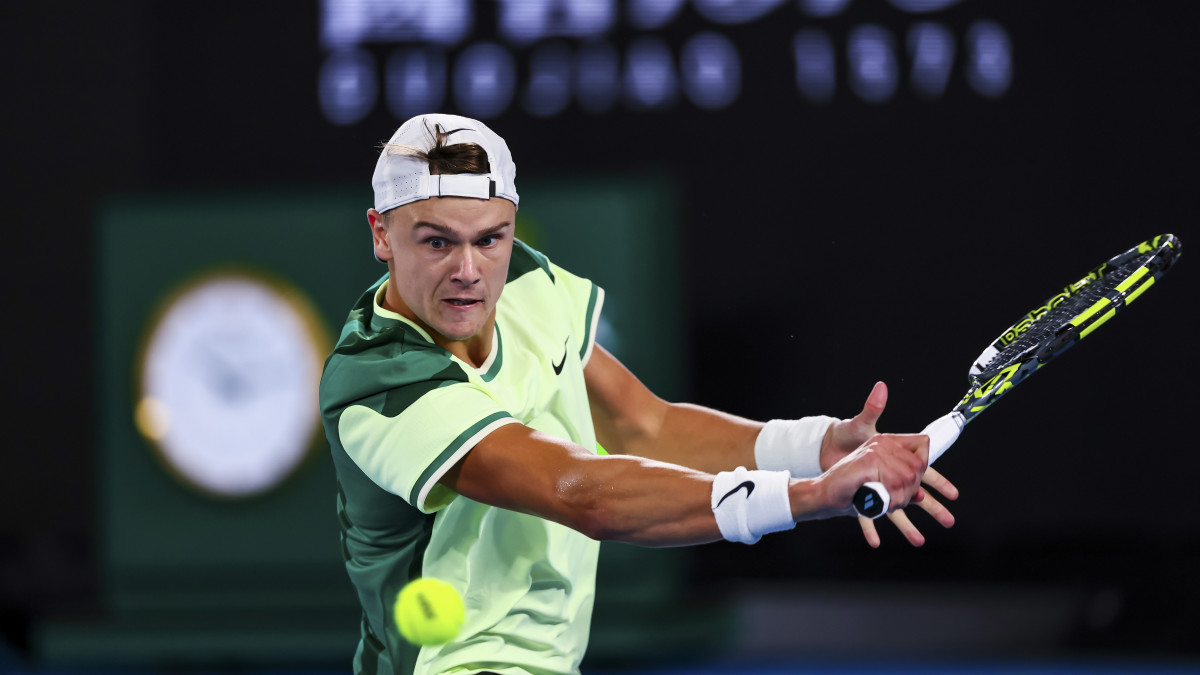 Holger Rune of Great Britain plays a shot against Arthur Cazaux at the Australian Open.