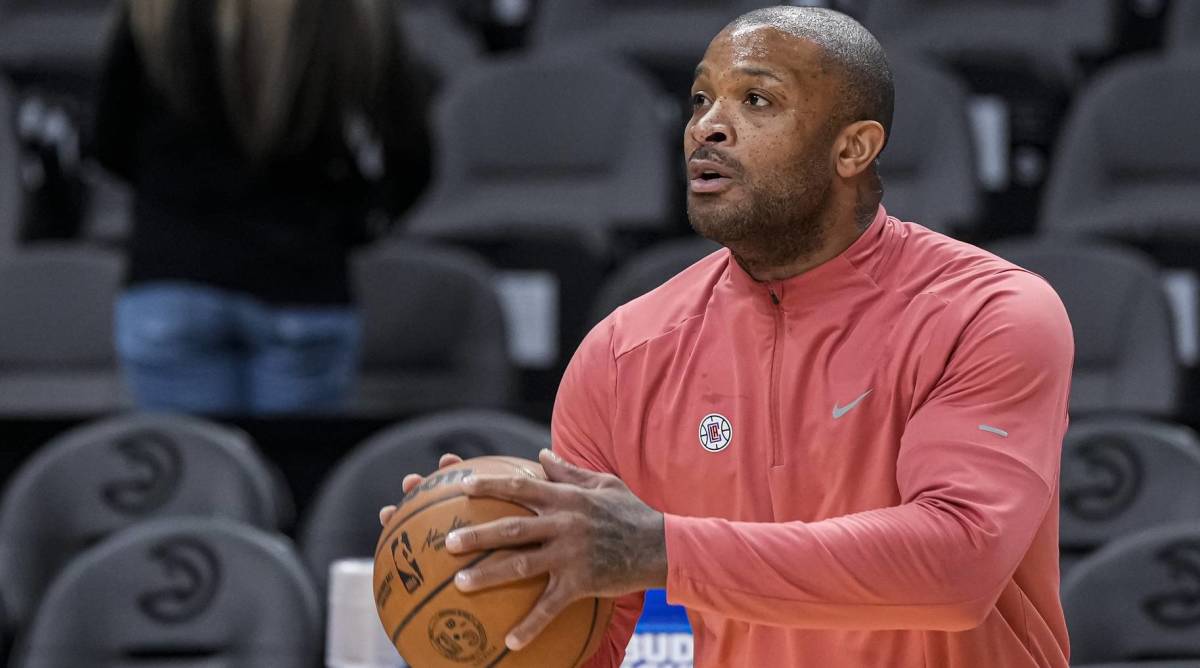 Clippers veteran P.J. Tucker shoots a ball in warmups before a game.