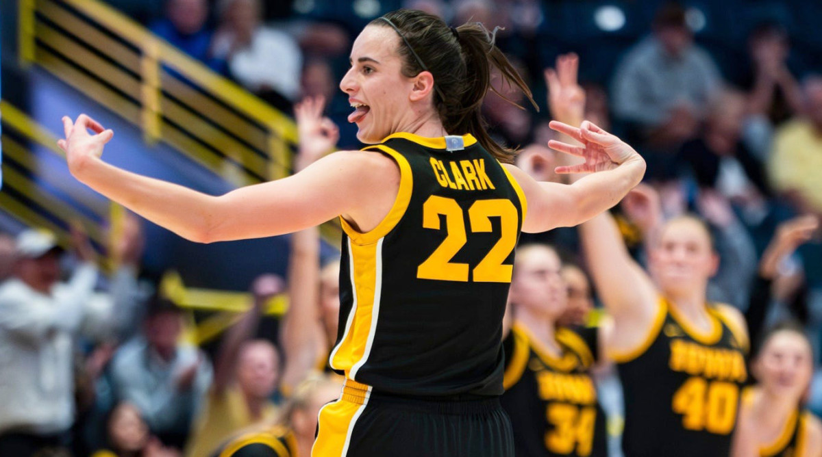 Iowa Hawkeyes guard Caitlin Clark celebrates a three-point basket against the Kansas State Wildcats.