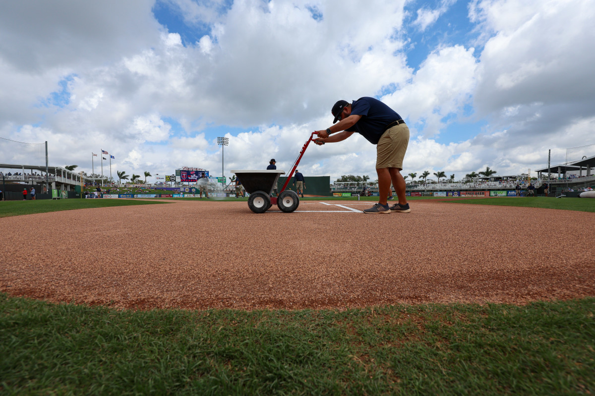 Mar 13, 2023; Fort Myers, Florida, USA; the Minnesota Twins grounds crew gets the field ready for a game against the New York Yankees during spring training at Hammond Stadium.