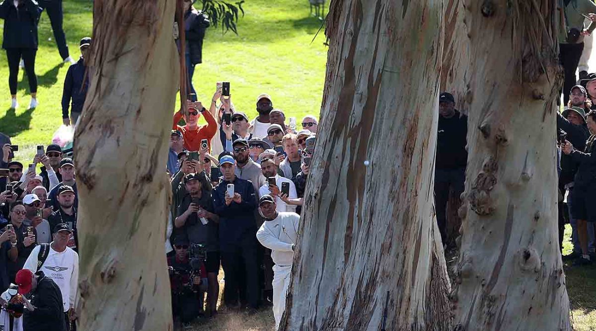 Tiger Woods plays his third shot on the 18th hole during the first round of the 2024 Genesis Invitational at Riviera Country Club in Pacific Palisades, Calif.