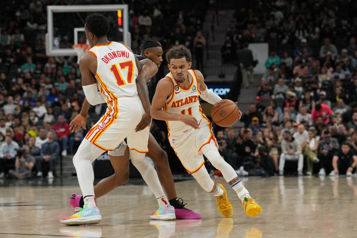 Mar 19, 2023; San Antonio, Texas, USA; Atlanta Hawks guard Trae Young (11) dribbles around a screen from forward Onyeka Okongwu (17) in the second half against the San Antonio Spurs at the AT&T Center. Mandatory Credit: Daniel Dunn-USA TODAY Sports