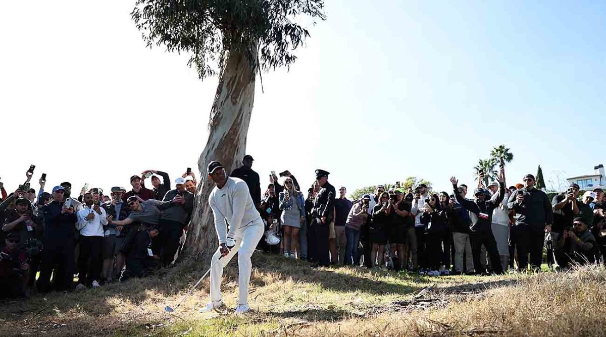 Tiger Woods lines up his shot on the 18th hole during the first round of the 2024 Genesis Invitational at Riviera Country Club in Pacific Palisades, Calif.