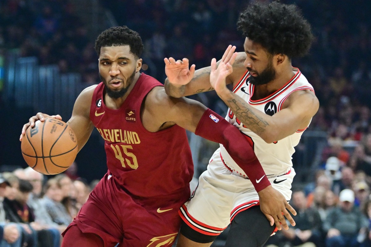 Cleveland Cavaliers guard Donovan Mitchell (45) drives to the basket against Chicago Bulls guard Coby White (0) during the first half at Rocket Mortgage FieldHouse. 
